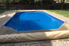 Wheatridge pool featuring a new deck, coping and wall-to-wall steps as well as an automatic Coverstar Cover installed on the deck