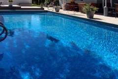 Centennial pool, complete design and installation with custom step/bench combo, automatic CoverStar Cover and deck