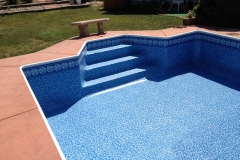 Englewood Champion pool renovation featuring custom colored concrete deck, walls, coping, step conversion and <a href="https://americanpoolsdenver.com/american-pools-vinyl-pattern-selector/" target="_blank">custom liner</a>