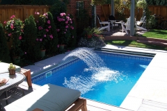 Denver pool (flowers and gazebo by Susan!) with custom deck, cover, bench, fountain, custom liner, walls and coping
